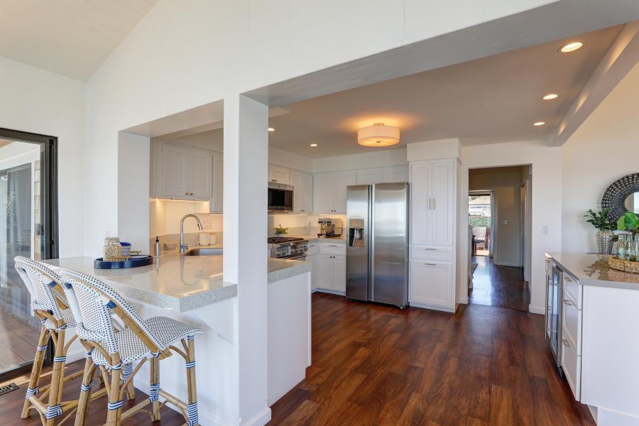 view into kitchen with wood floors